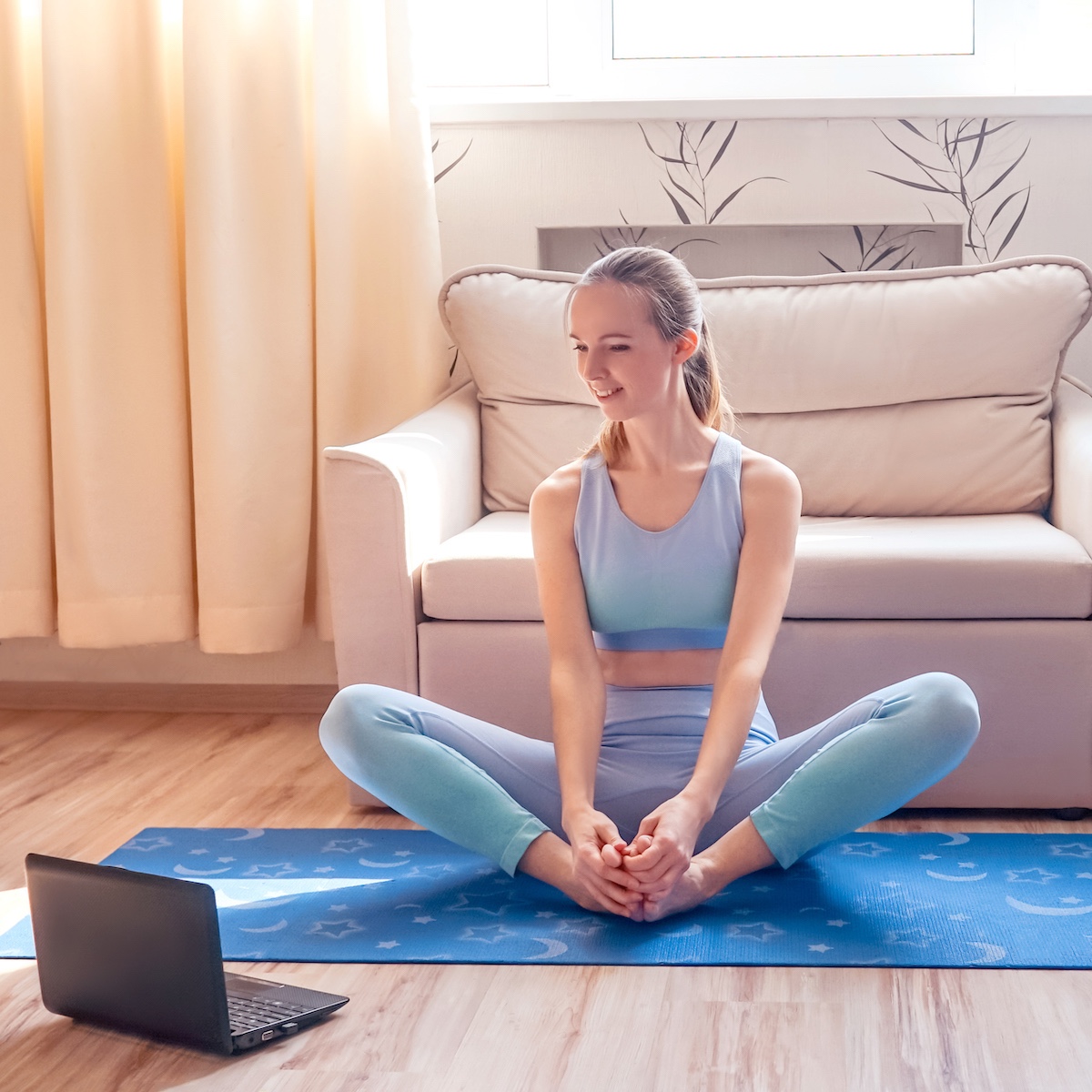 fitness-woman-in-baddha-konasana-watch-tutorial-2021-08-31-17-23-41-utc